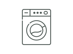 Waschmaschine mit runder Trommel und Bedienelementen oben.